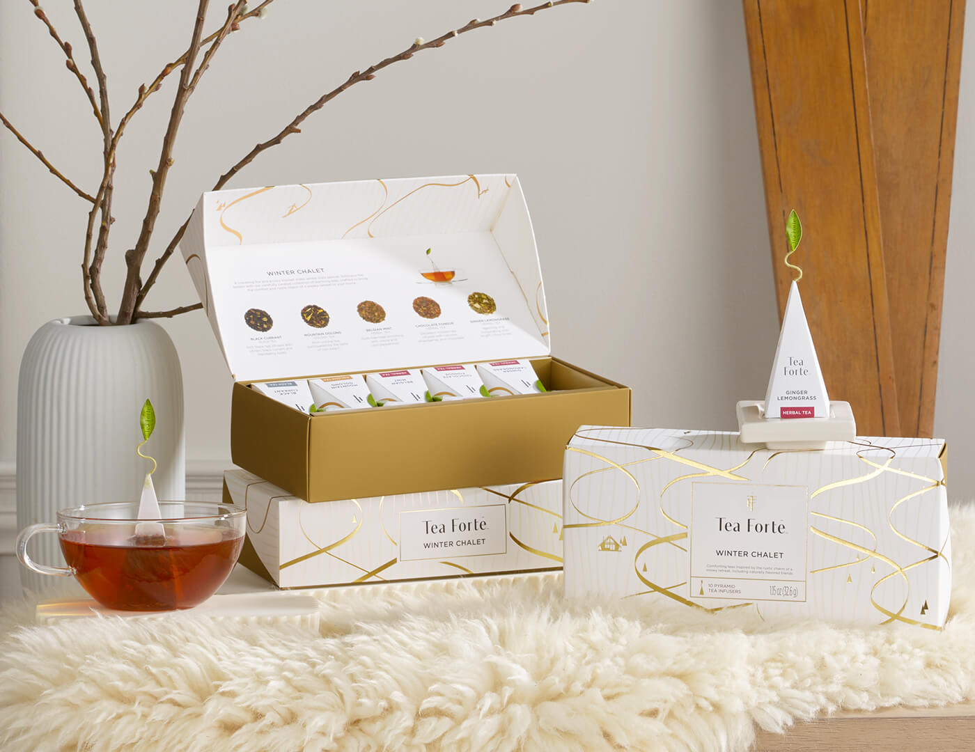 Tea packaging with a cup of tea on a soft, flurry white surface