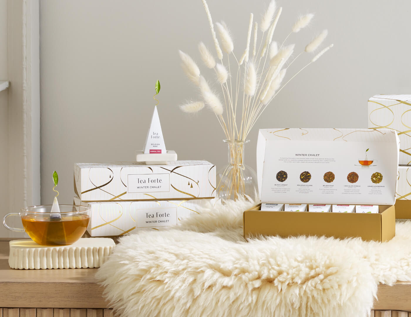 Winter Chalet Petite Presentation Boxes and a glass of tea on a wooden surface with decorative elements